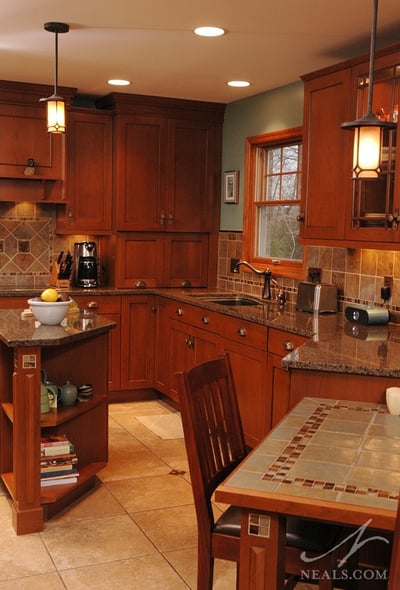 In this Neal's kitchen remodel, open shelving at the end of the small island and a table-height peninsula are built-in elements reminiscent of the classic style.