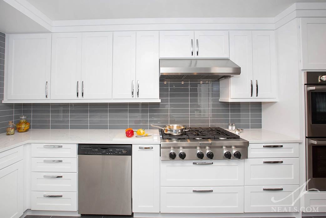 white kitchen with stainless steel appliances