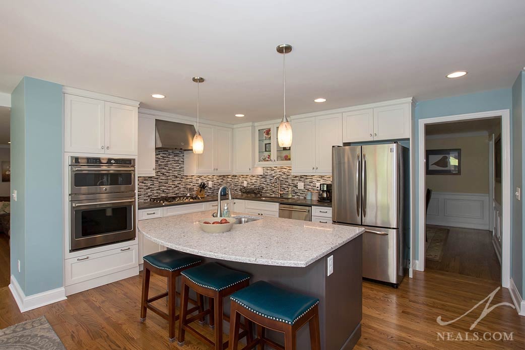 Layers of light, including pendant fixtures and under-cabinet lighting, creates a pleasant lighting scheme in this Montgomery kitchen.