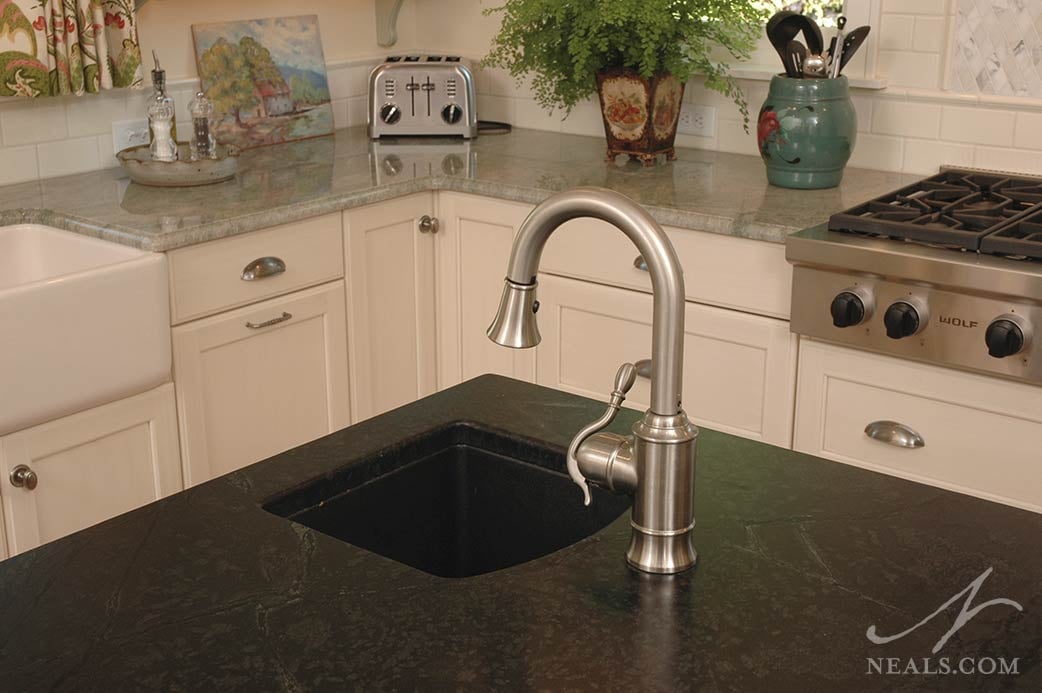 The island in this Glendale kitchen is outfitted with a small prep sink.