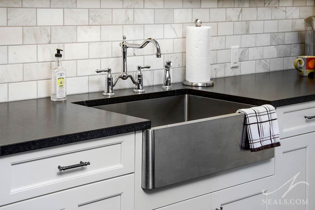 Farmhouse sink in a metallic finish in this Hyde Park kitchen.