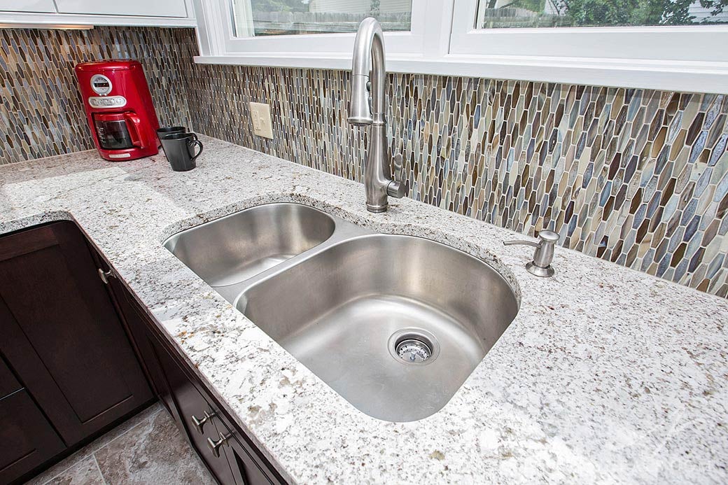 A stainless steel sink in this Hyde Park kitchen remodel.