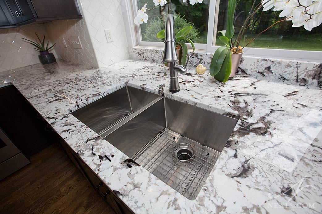 A double bowl sink with modern square corners in this Loveland kitchen.