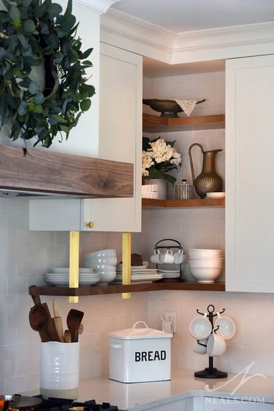 open shelving in the corner of kitchen