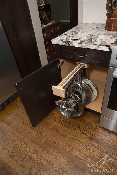 A slide-out rack for pans in this Loveland remodel makes storage easy and convenient.