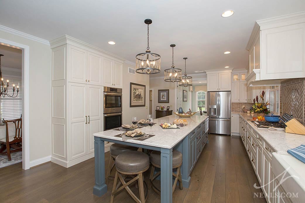 With cabinets on both sides and a seating area, the island in this Withamsville project doubles the kitchen function.