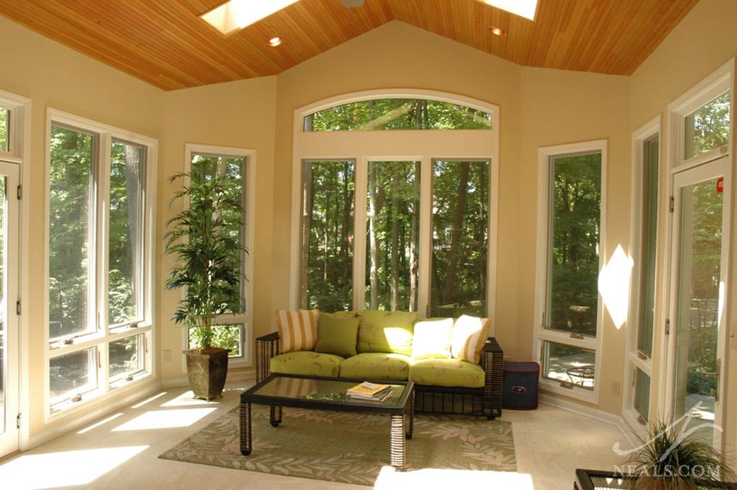 The windows of this Loveland three-season sunroom are awning windows that can be opened for some fresh air.