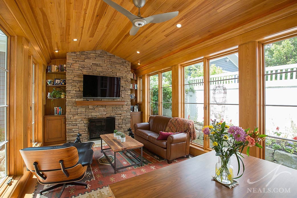 A fireplace at the end of this Montgomery sunroom creates a cozy atmosphere for both relaxing alone or socializing with guests.