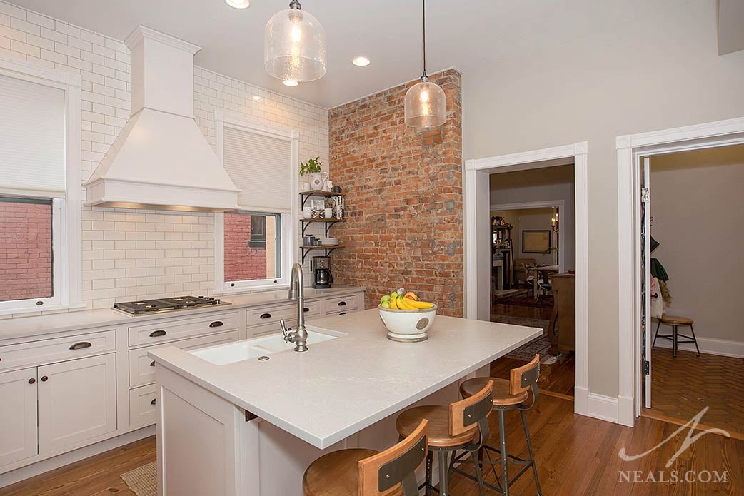 original brick wall in old home kitchen remodel