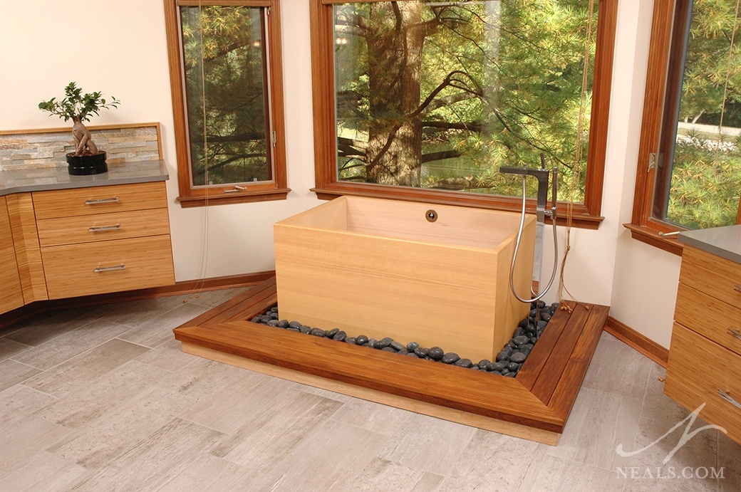 A neutral mix of warm woods, pale bamboo, and light cream walls helps to convey the Japanese infuences in this Sycamore Township master bathroom.